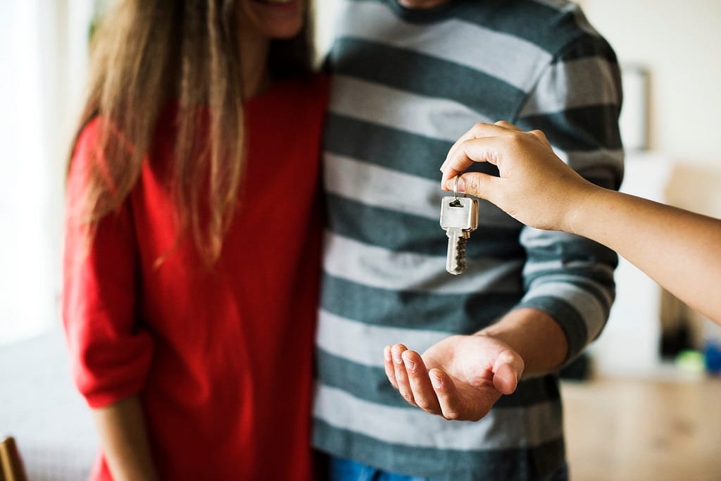 a couple receiving a house key
